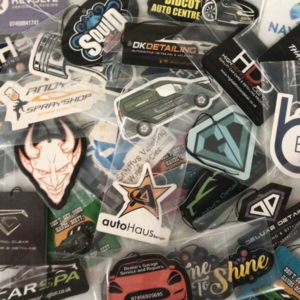 Scenters Custom Air Fresheners Scattered On A Tabletop